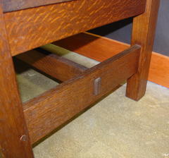 Close-up of large pinned thru-tenon at the side stretcher, note pinned tenon construction on the legs also.